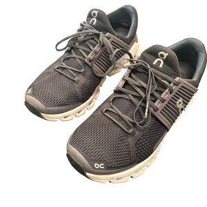 On Running Gray Athletic Shoes with Modern Design and Cushioning